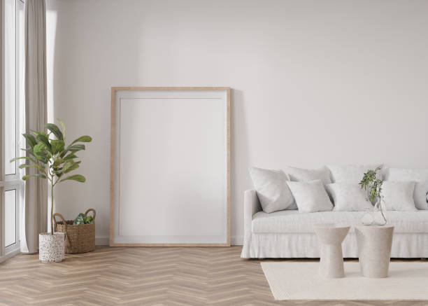 istock Empty vertical picture frame standing on parquet floor in modern living room. Mock up interior in scandinavian style. Free, copy space for picture. Sofa, plants. 3D rendering. 1395571719