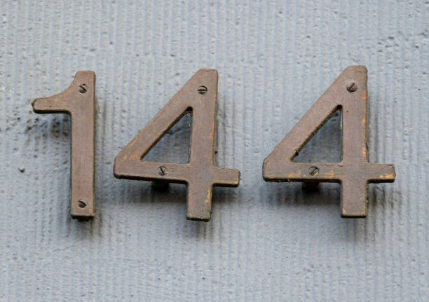istock Metal home number on a wall 1395572916