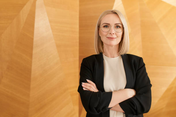 Portrait of successful mature businesswoman at corporate modern office stock photo