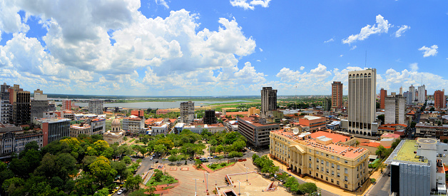 Asunción, Paraguay: city center skyline from the central square, downtown, Plaza de la Democracia, Asuncion Bay and River Paraguay in the background - historic district -  Asuncion was founded on August 15, 1537, by Juan de Salazar y Espinoza, which makes it one of the oldest cities in South America.