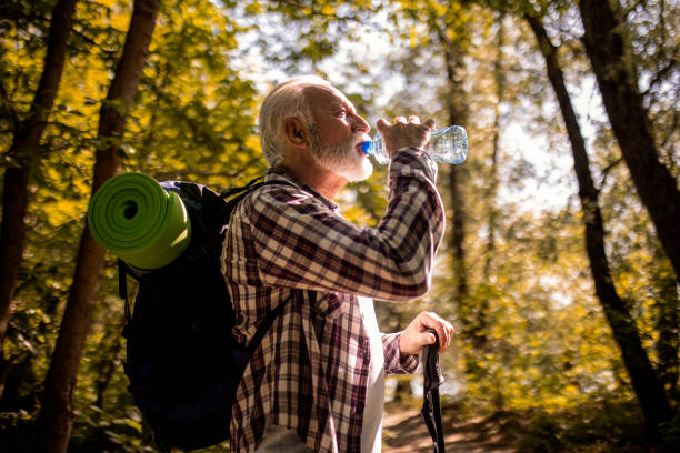 istock Senior man taking a break hydrating 1395578898