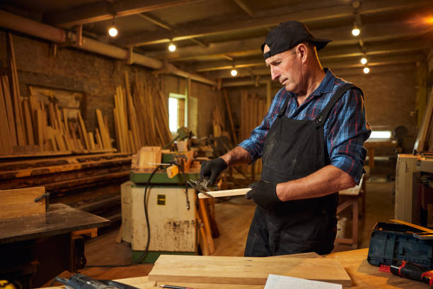istock Senior professional carpenter working with caliper in the carpentry workshop 1395579779