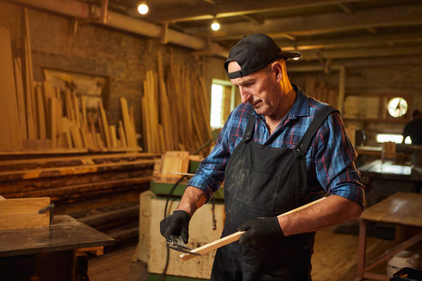 istock Senior professional carpenter working with caliper in the carpentry workshop 1395579786