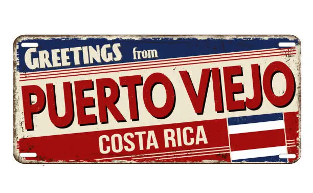 Vector illustration of Greetings from Puerto Viejo vintage rusty metal plate
