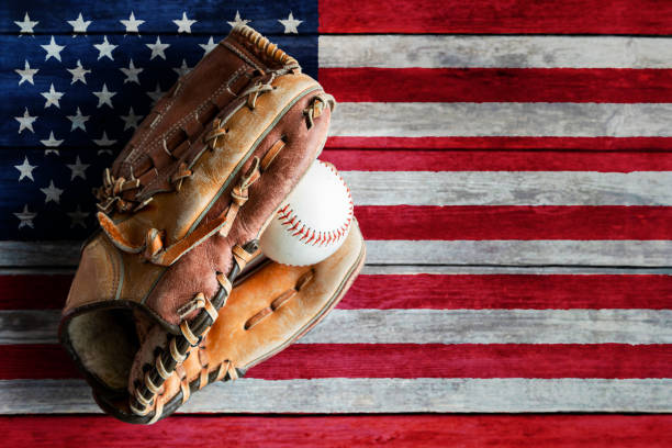 Leather Baseball or Softball Glove With Ball on Painted US Flag stock photo