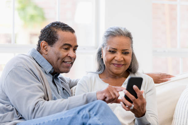 istock Husband and wife sit on the couch 1395585844