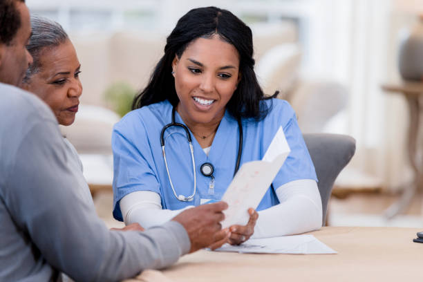 istock Nurse helps to explain the brochure 1395585856