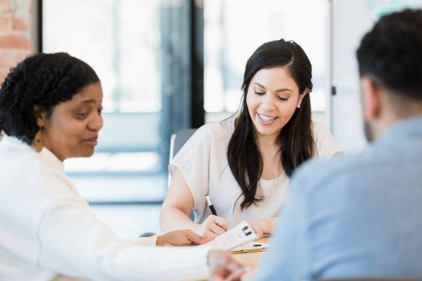 istock Small business CEO leads staff meeting 1395586878