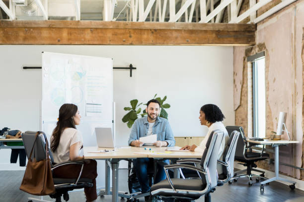 istock Diverse team meets in conference room 1395586882