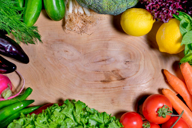 istock Various vegetables on the flipchart. Carrot, tomato, lettuce, cucumber, onion, lemon, broccoli, mint, eggplant, pepper and radish 1395587279