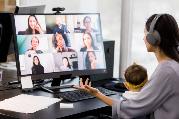 istock Young adult meets with her friends virtually 1395588079