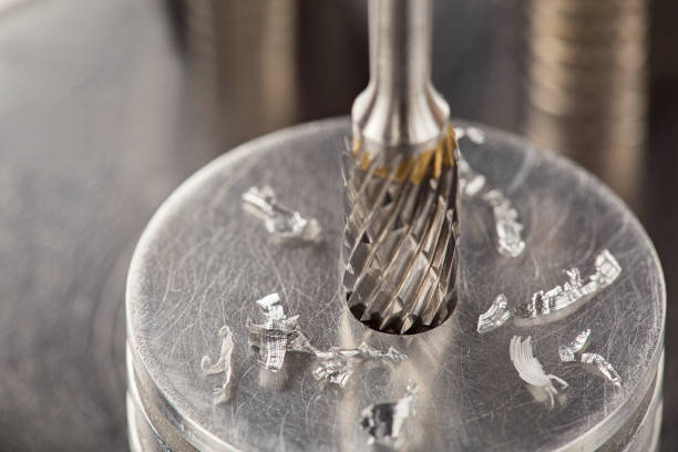 istock Milling cutter and drill bit make sink in hole in steel billet. Locksmith work. 1395590253