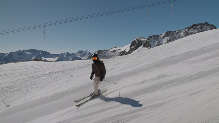 Young Woman Skiing Downhill Slope