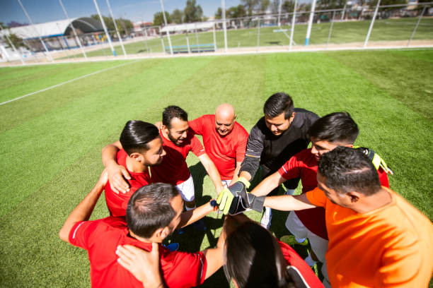 istock Soccer team huddling 1395600458