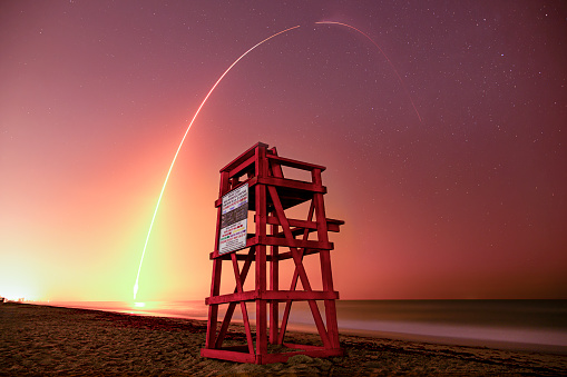NASA Launch w/ Space X Rocket shooting at night in front of Life guard Stand