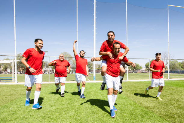 istock Soccer team celebrating victory 1395606948