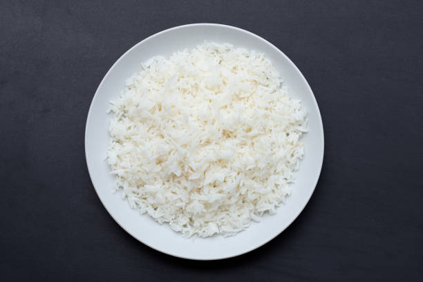 istock Dish of rice on dark background. 1395607651
