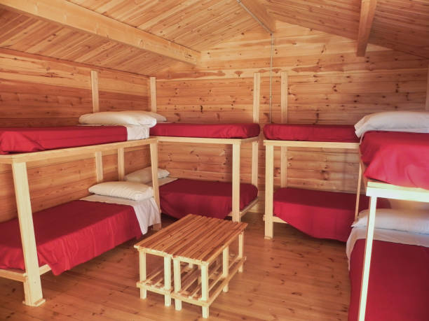 a log cabin with bunk beds - rustic bedroom cabin indoors imagens e fotografias de stock