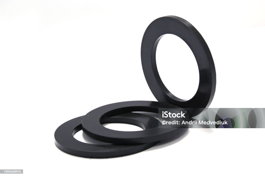 Pile of rubber gaskets and washers isolated on white. High quality photo Pile of rubber gaskets and washers isolated on white. High quality photo. Gasket - Mechanical Seal Stock Photo