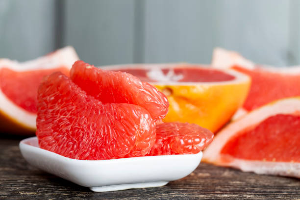 istock peeled and divided into parts ripe red grapefruit 1395612689