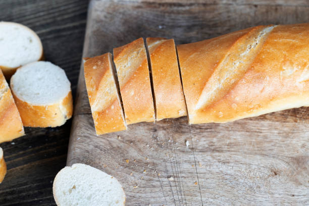 istock wheat baguette cut into pieces on a cutting board 1395612718