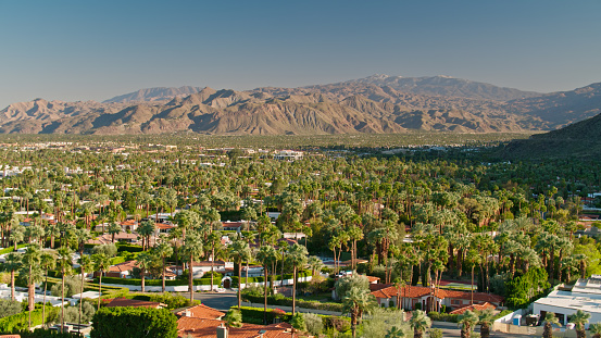 Aerial view of residential streets in the Las Palmas neighborhood of Palm Springs, California on a late sunny afternoon. \n\nAuthorization was obtained from the FAA for this operation in restricted airspace.
