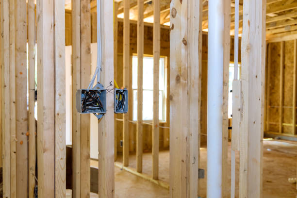 istock Installing electric sockets on the wall new home new home construction 1395616379