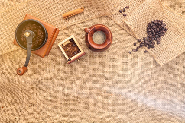 istock from above Antique grinder with little drawer and coffee beans 1395618032