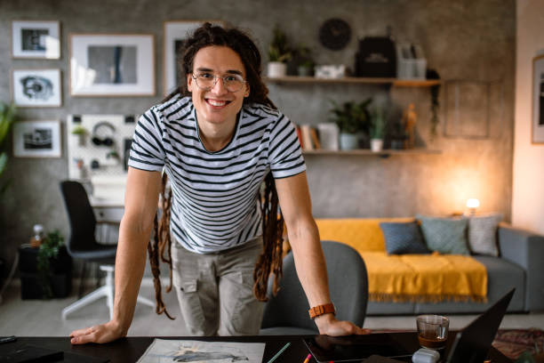 istock Portrait of young graphic designer in studio looking at camera 1395622150