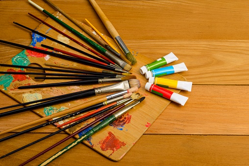 Group of all kinds of brushes to make oil or watercolor paintings. Tools of an artist painter on canvas or any other materials.