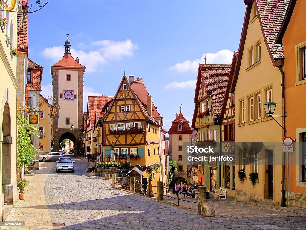 Street view of houses in Rothenburg ob der Tauber, Germany View of the colorful half timbered buildings and towers of the town of Rothenburg ob der Tauber, Germany. Rothenburg Stock Photo