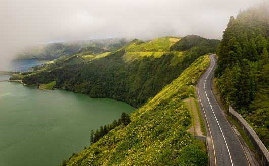 Amazing drone view of empty asphalt roadway near Lagoa do Fogo located in highlands on Sao Miguel island