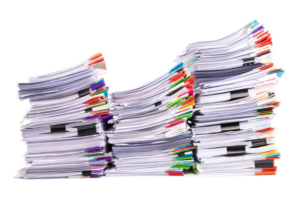 istock Stack of business papers isolated on white background 1395632576