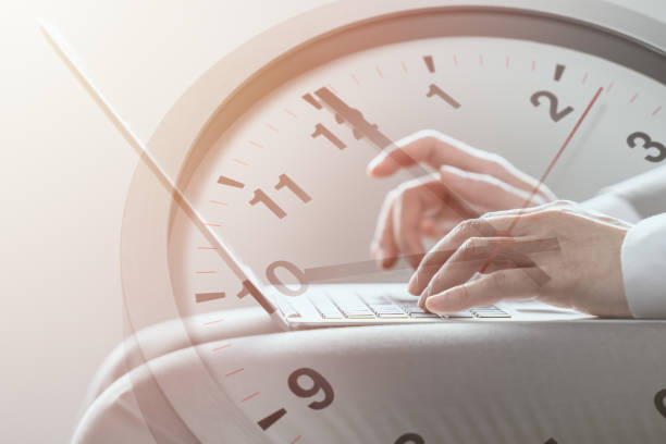 istock Business times working hours with digital communication technology concept. people work typing on laptop computer overlay with in time clock. 1395632818