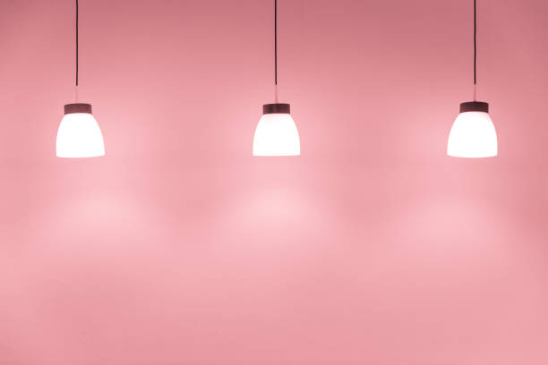 istock ceiling drop down light decoration on sweet pink wall for interior lighting background 1395632841