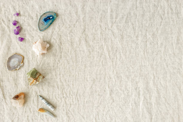 istock Top view different crystals and stones on table, healing minerals agate, quartz, amethyst, onyx. Stones for crystal therapy. Flat lay with semiprecious gems, alternative medicine concept 1395634504