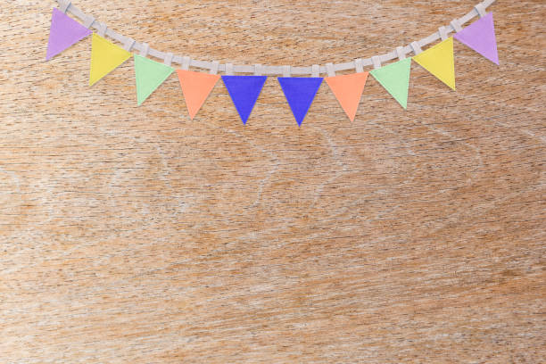 istock Flag garland on wood texture background 1395637091
