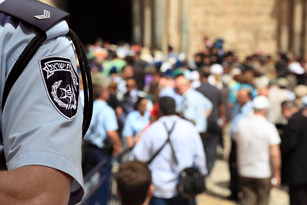 Israel Police Officer in the Crowded Street stock photo