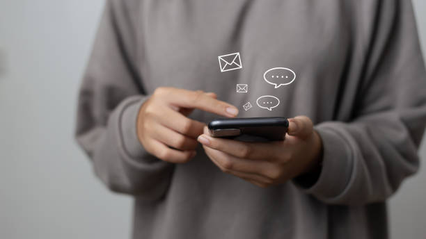 istock Social Network Concept, woman using the phone to send text messages ,Social media interactions on mobile smartphone , notification icon, messages, email, comments. 1395646204