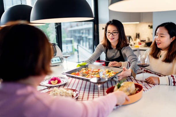istock Asian chinese friends  having dinner at home 1395646350