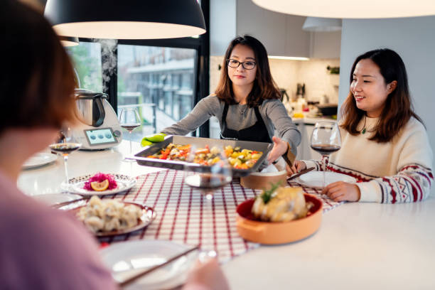 istock Asian chinese friends  having dinner at home 1395646362