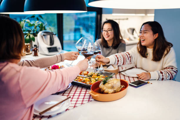 istock Asian chinese friends  having dinner at home 1395646364