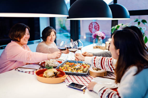 istock Asian chinese friends  having dinner at home 1395646383