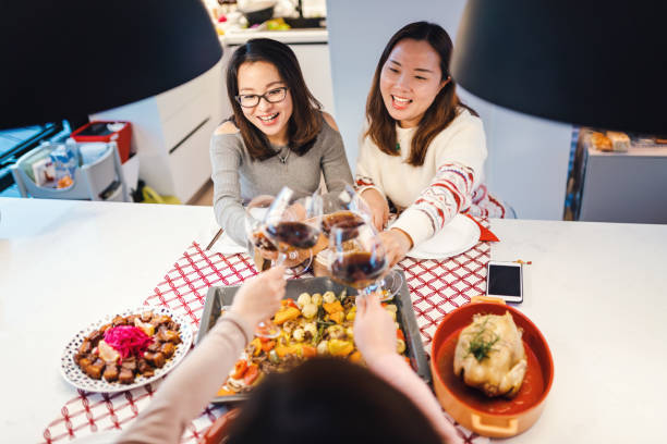 istock Asian chinese friends  having dinner at home 1395646389