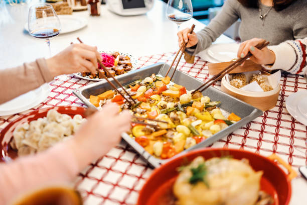 istock Asian chinese friends  having dinner at home 1395646409