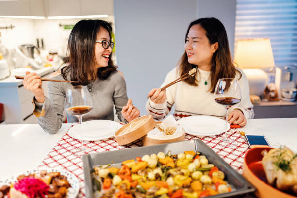 istock Asian chinese friends  having dinner at home 1395646416