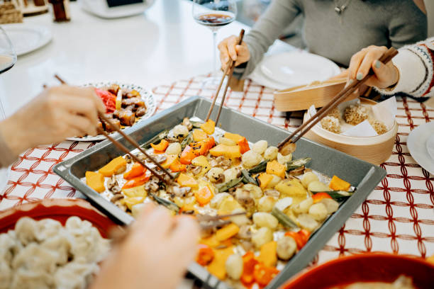 istock Asian chinese friends  having dinner at home 1395646419