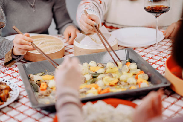 istock Asian chinese friends  having dinner at home 1395646450