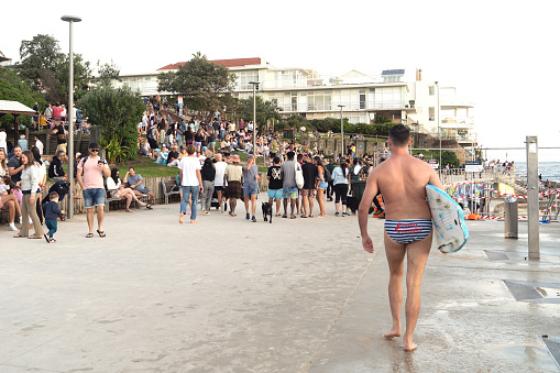 Sydney, Australia, May 1 2022- Crowd of young people enjoying the sunset at the Bondi beach