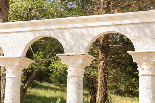 Italian-Inspired Cream-Colored Columns Outdoors in Nature in Tennessee in the Spring of 2022